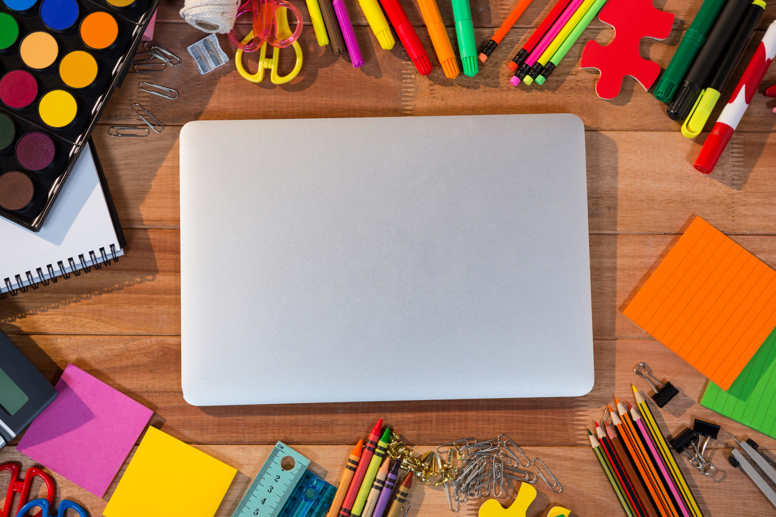 Standard Sticker Sizes: The Ultimate Shape and Dimensions Guide (2026) 3 Laptop covered in custom die cut stickers and colorful shapes